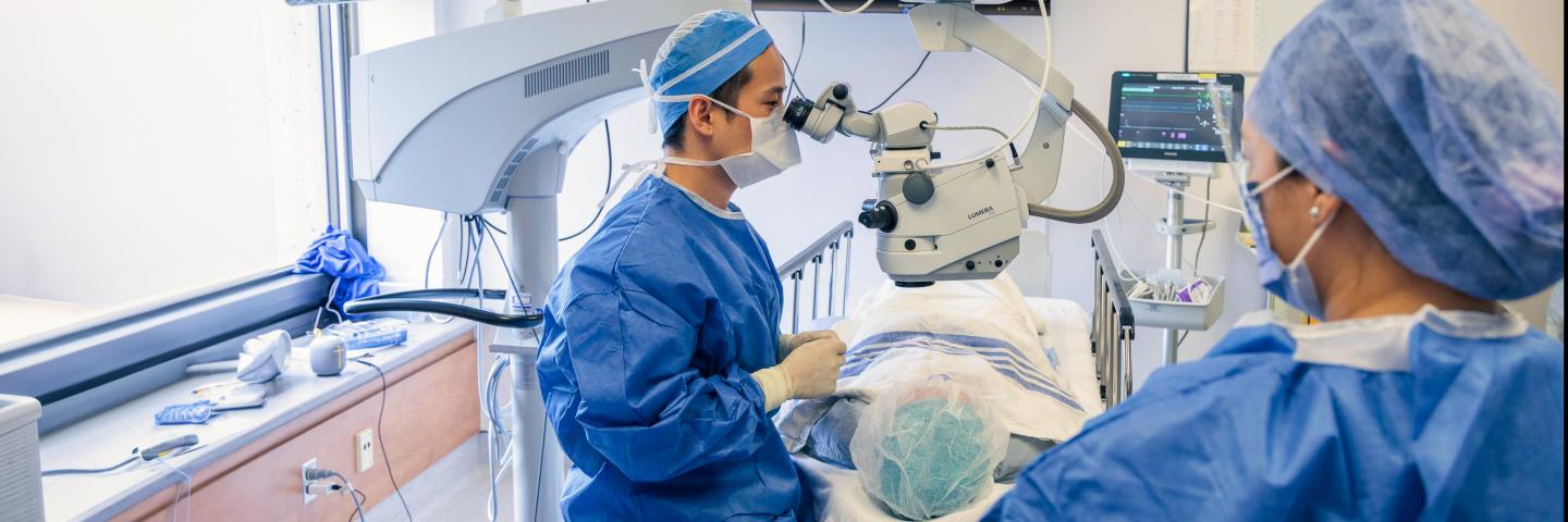 Doctor performing eye surgery.