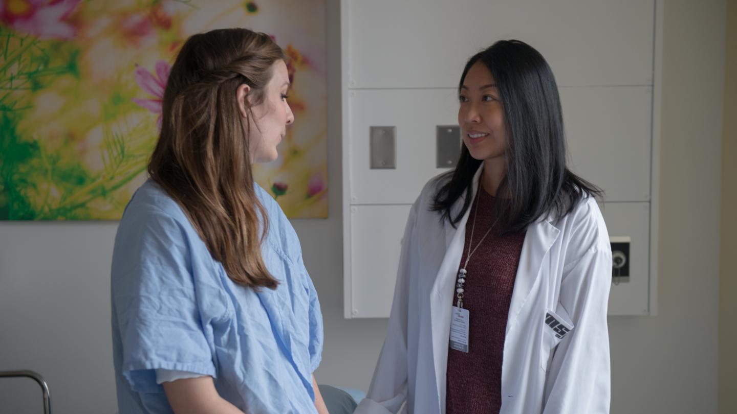 A doctor speaking with a patient