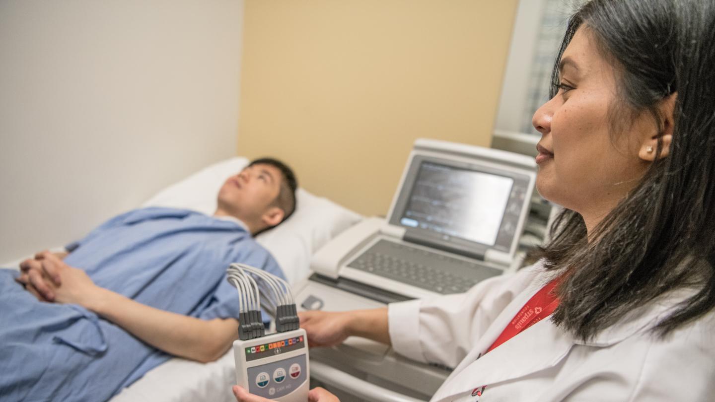 Nurse performing a test on a patient