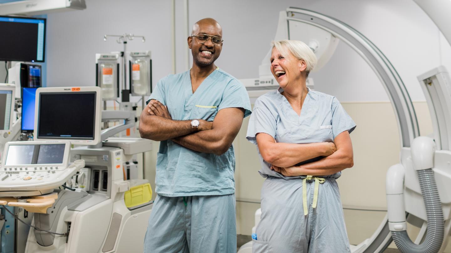 Two surgeons rejoicing in an operating room