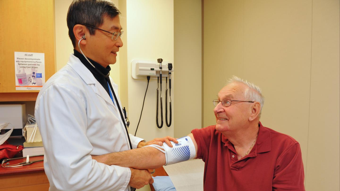 Doctor checking a patient's blood pressure