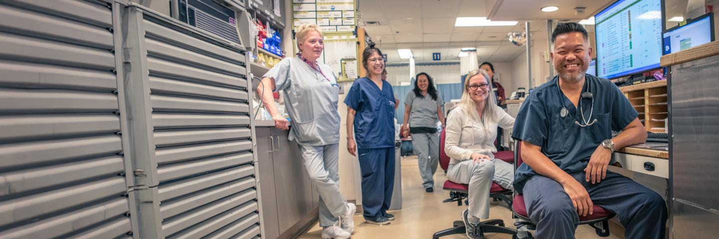 Nurses and doctors smiling in a hospital office