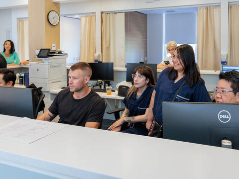 The Road to Recovery team working together behind a desk
