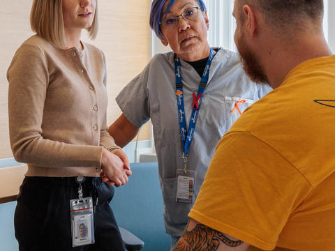 The Road to Recovery team talking with a patient 